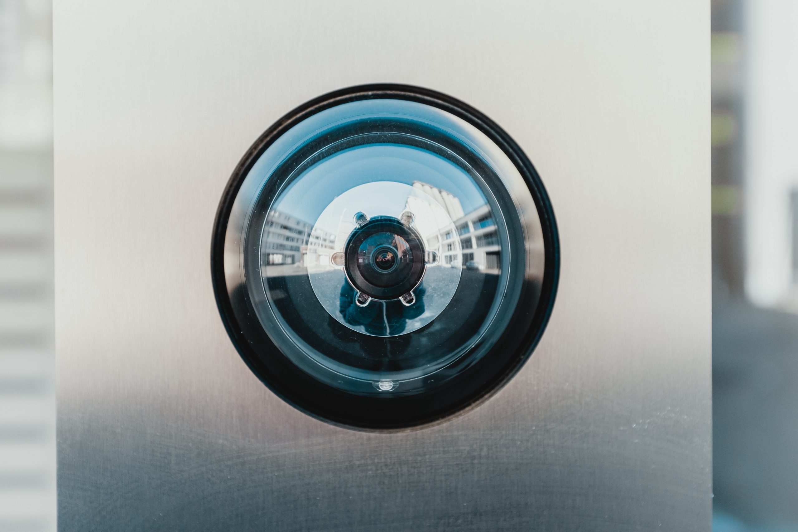 Dome security camera mounted on a steel panel